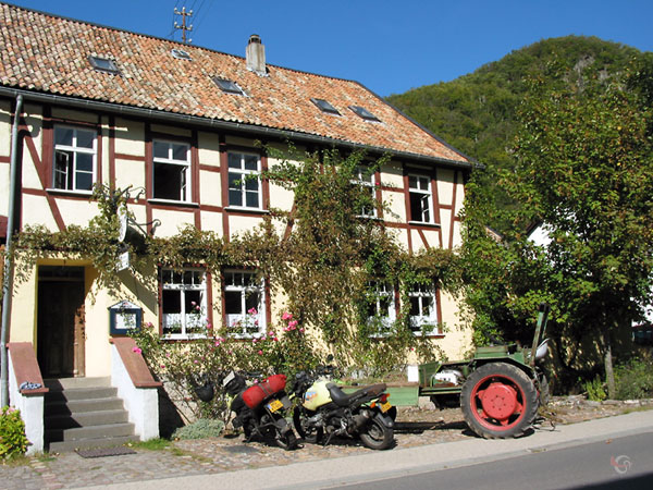 Two motorcycles in front of a Gasthaus
