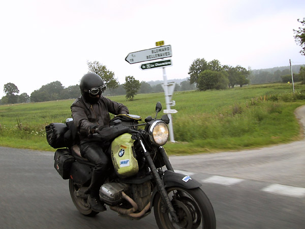 Ernst on his BMW R1100GS, looking to his tankbag, fumbling with it