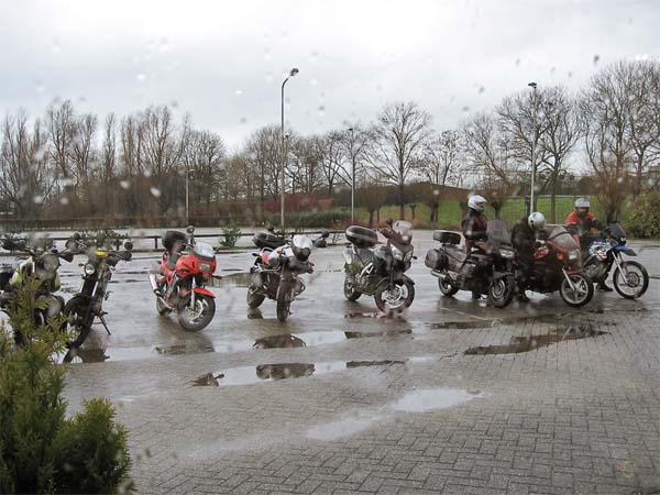 Motorcycles in the rain on a parking lot